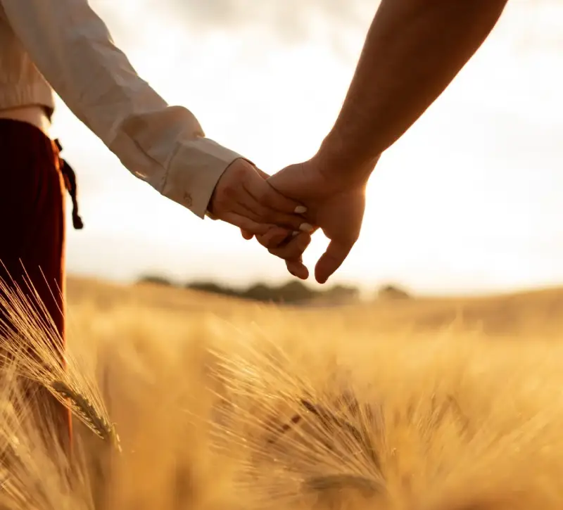 Side view partners holding hands